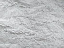 Crumpled paper texture isolated on white background photo