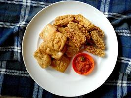 Tempe Goreng Indonesian Food or fried tempe on a plate. Indonesian culinary food photo