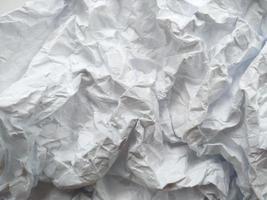 Crumpled paper texture isolated on white background photo