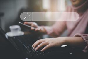 Searching Browsing Internet Data Information with blank search bar. man's hands are using smartphone and keyboard to Searching for information. Using Search Console with your website. photo