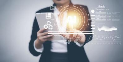 Businesswoman touch arrow with Artificial Intelligence on big data network machine learning and data on the dark background, artificial intelligence technology, innovation and futuristic. photo