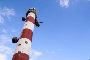 Red and White Lighthouse photo