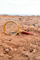 Magnifying glass on ground photo