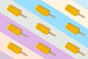 Yellow ice cream on colorful background photo