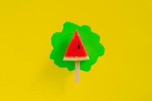 Red slice watermelon design as ice cream with stick photo