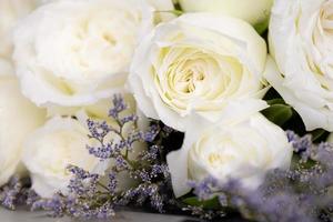 Beautiful big and a luxury bouquet of white roses arranged in a bunch. Close up shot with details photo