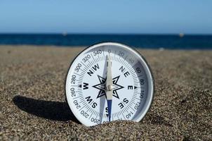 Tourist Compass in the Sand photo