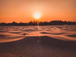 sunset in The desert, sunset desert close up short with the ground, Sand dunes sun on top of the forest, Evening sunset Sand dunes photo