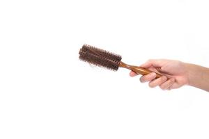 hair problem holding loss hair comb in hand, isloated on white background photo