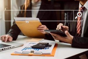 Searching Browsing Internet Data Information Networking Concept. two businessman hand using smart phone,mobile and tablet in office. photo