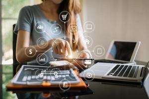 Businessman working with smart phone and laptop and digital tablet computer in  office with digital marketing media  in virtual icon photo