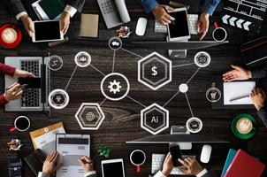 Top view of business Group of Multiethnic Busy People meeting with other in modern office with laptop computer, smartphone, tablet, coffee photo