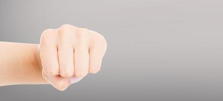 Woman fist isolated on a grey background. Front view. photo