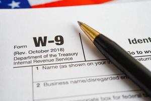 Tax form W-9 Request for Taxpayer Identification Number and Certification, business finance concept. photo