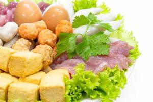 various fresh vegetables for sukiyaki on white background photo