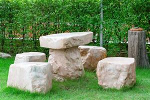 stone table set in garden photo