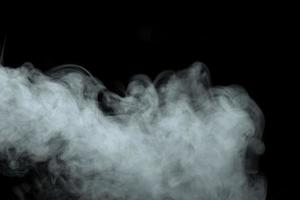 Abstract powder or smoke effect isolated on black background photo