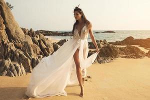 Young and beautiful bride on the beach photo