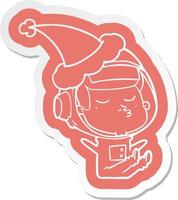 cartoon  sticker of a confident astronaut wearing santa hat vector