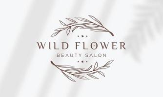logotipo dibujado a mano con elementos florales botánicos con flores silvestres y hojas. logo para spa y salón de belleza, boutique, tienda orgánica, boda, diseñador floral, interior, fotografía, cosmética. vector