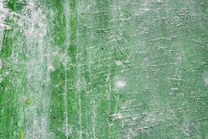 Texture of a concrete wall with cracks and scratches which can be used as a background photo