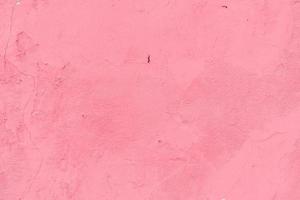 Texture of a concrete wall with cracks and scratches which can be used as a background photo