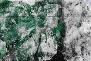 Texture of a concrete wall with cracks and scratches which can be used as a background photo