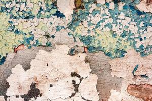Texture of a concrete wall with cracks and scratches which can be used as a background photo