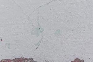 textura de una pared de hormigón con grietas y arañazos que se pueden utilizar como fondo foto