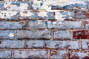 textura de una pared de ladrillo con grietas y arañazos que se pueden utilizar como fondo foto