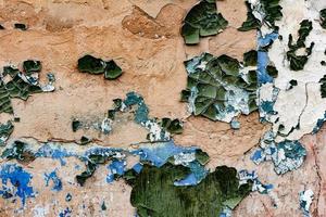 Texture of a brick wall with cracks and scratches which can be used as a background photo