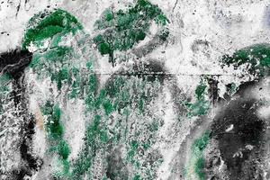 Texture of a concrete wall with cracks and scratches which can be used as a background photo