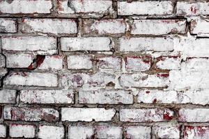 textura de una pared de ladrillo con grietas y arañazos que se pueden utilizar como fondo