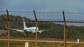 Airliner approaching the runway over oceanic beach video