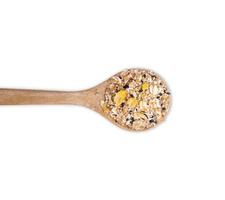 muesli multi fruits in spoon isolated on white background. top view photo