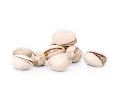 toasted pistachios on a white background photo