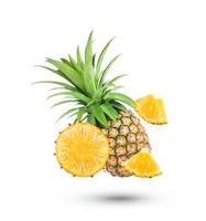 pineapple and pineapple slice with leaves isolated on white background photo