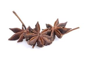 Star anise spice fruits and seeds isolated on white background closeup photo