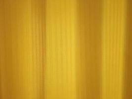 Light brown curtains and soft have light the scenery the outside. photo