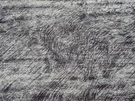 An old wooden plank table with a mottled surface and a pattern. photo