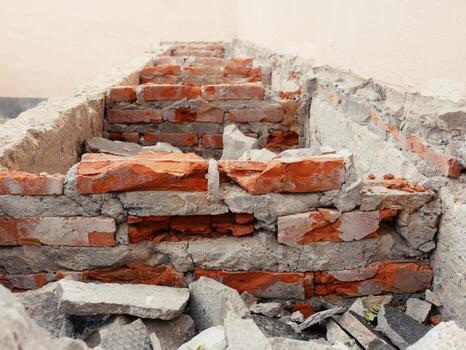 Close-up of the rubble of an industrial building collapsing into a pile of concrete and brick. and the jagged debris caused by the failure of the engineers at the abandoned construction. photo