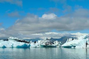 Bright clear blue iceberg floating in the Jokulsarlon lake blue cold water in Iceland 61 photo