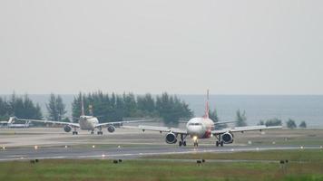 PHUKET, THAILAND - NOVEMBER 26, 2017 - AirAsia Airbus A320 HS BBB braking after landing at Phuket International airport video