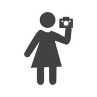 mujer tomando foto glifo icono negro vector