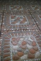 The texture of the orange embossed floor in front of the house photo