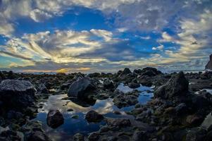 Sunset reflection and rocks photo