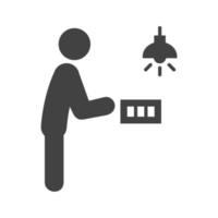 hombre encendiendo la luz en el icono de glifo negro vector