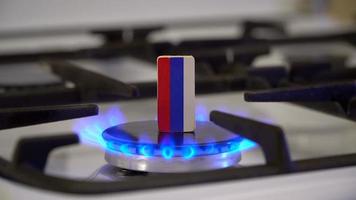 Shortage and gas crisis. Flag of the Russian on a burning gas stove video