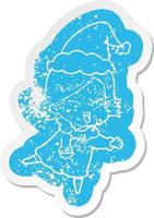 happy cartoon distressed sticker of a girl wearing santa hat vector