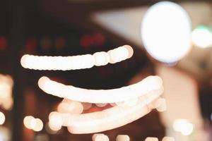 Blurred images of thailand night streets party in city, bokeh light,festival background. photo